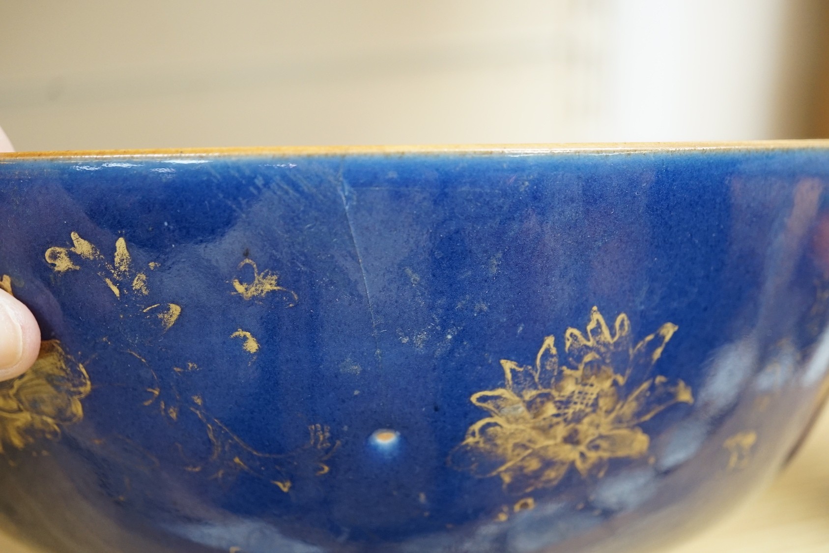 An 18th century Chinese gilt decorated powder blue glazed bowl, 26cm diameter